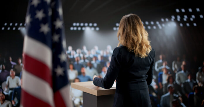 Female Government Official Empowering A Big Crowd Through Woman giving speech about Brexit issue