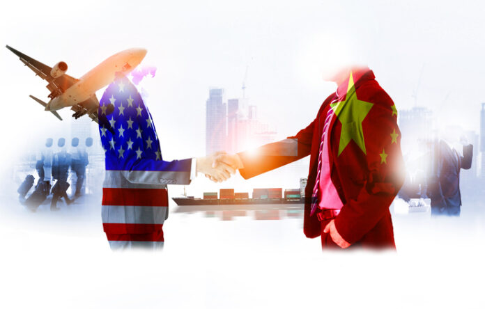 two businessman shake hands, china-usa trade war , The world logistics , logistic network distribution on background Industrial Container Cargo freight ship for fast instant shipping china-usa trade war