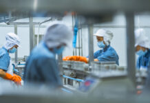 Prisoners of Identity Masked workers labor at a factory in China