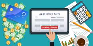 Small business bank mortgage loan or lending, online application form on flat tablet screen with hand click button isolated on desk with cash, credit card, calculator, cup of coffee, pencil, chart