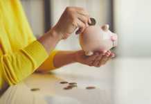 Tips for Saving Money on Common Expenses Close up of woman puts euro coin into piggy bank