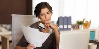 Woman Paying Credit Card Bills