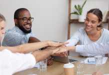 Entrepreneur Vinod Ramchandra Jadhav Explains 6 Ways Of Raising Capital For Your New Business Launch Happy smiling corporate diverse team joining hands together showing unity