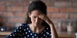 How BEC Scams Target Financial Services Companies Worried Latin woman having problems with mobile phone
