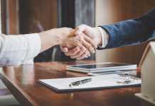 How to Maximize the Selling Price of Your Business Real estate agent and customers shaking hands together celebrating finished contract after about home insurance and investment loan, handshake and successful deal