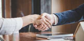 How to Maximize the Selling Price of Your Business Real estate agent and customers shaking hands together celebrating finished contract after about home insurance and investment loan, handshake and successful deal