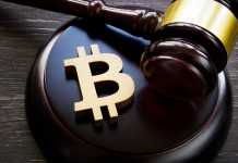Bitcoin symbol and gavel to regulate cryptocurrencies market.