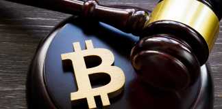 Cryptocurrency Regulation Bitcoin symbol and gavel to regulate cryptocurrencies market.