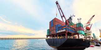 How to Unload a Shipping Container: Methods and Basic Rules container ship commercial vessel alongside in port for loading and discharging containers services in maritime transports in World wide logistics