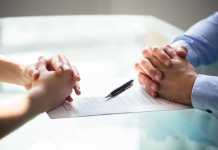 3 Ways to Get Your Finances in Order Before a Divorce Two Businesspeople Hand With Document