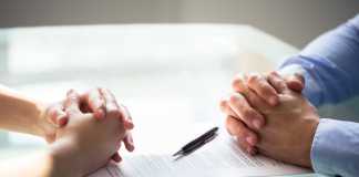 3 Ways to Get Your Finances in Order Before a Divorce Two Businesspeople Hand With Document