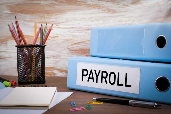 Payroll, Office Binder on Wooden Desk