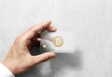5 Best Crypto Credit Cards 2022 Hand holding bitcoin card template with rounded corners and embossed gold logo. Plain plastic cryptocurrency payment-card display front, design mock up. Electronic mining template.