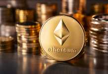Ethereum Classic Price Surges by Whopping 79% Rally Frankfurt, Hesse, Germany - April 12, 2018: Cryptocurrency coin Ethereum with several stacks of coins in the background