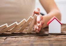 Why You Need the Best Home Warranty Plans Human Hand Stopping The Wooden Blocks From Falling