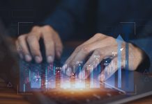 Client Deposits with U.S. Forex Brokers Decrease to $505 million Closeup hand using computer trading online on digital chart visual screen technology