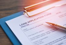 Commercial Fleet Financing For Small Businesses: What Are Your Options? Loan application form with pen on paper / financial loan negotia