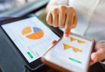 7 Strategic Use Cases For Software To Grow Your Business Businesswoman check data in smartphone and tablet