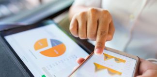 Businesswoman check data in smartphone and tablet