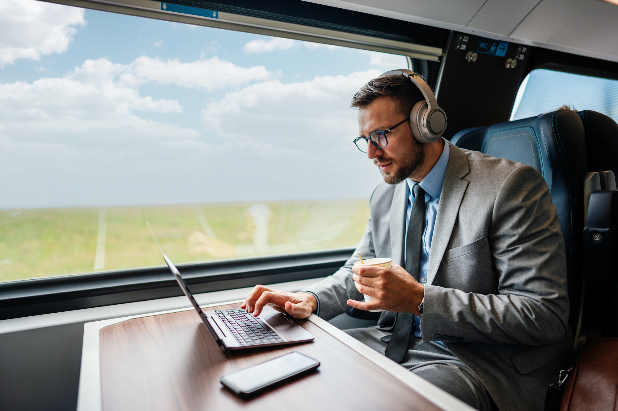 Handsome middle age businessman using his laptop computer while