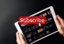 Subscription Platforms for Creators: The New Frontier in Monetizing Digital Content Subscription icon. Online video red subscribe button. Internet service on laptop digital tablet blured technology background. Social media concept. Streaming video.