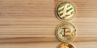 GDANSK, POLAND - August 16, 2018: Gold physical Bitcoin, Litecoin and Ethereum coins.