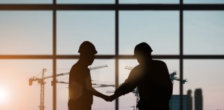 Silhouette of engineer and construction team working at site over blurred background for industry background with Light fair.Create from multiple reference images together
