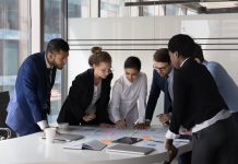 Strategizing with the LQD ETF: The Role of Corporate Bonds in Diverse Investment Portfolios Multiracial staff members cooperate together gather in boardroom at briefing