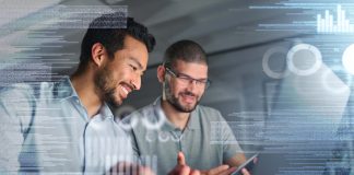 Information technology, laptop hologram and people stock market research, statistics and graph or chart analysis. Trading, digital overlay or software of teamwork men fintech data analytics at night