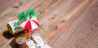 Saving for a Romantic Getaway: Cash and Miniature Beach Accessories