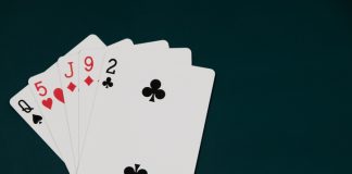 Playing cards on a dark background, games of chance