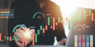 Businessman interacting with laptops, phones, and tablets with featuring stock tickers or graphs, cryptocurrency and new trading platforms, ideas and perspectives, Stock investment,New technology