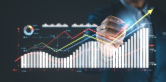 Businessman analyze graph or chart using digital pen on virtual screen.