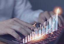 Businessman using laptop, analytics and finance concept and banking technology, chart from laptop, business growth concept
