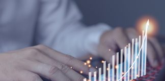 Businessman using laptop, analytics and finance concept and banking technology, chart from laptop, business growth concept