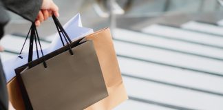 hand holding a shopping bag