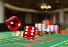 Close up shot of a pair of dice rolling down a craps table. Selective focus.Gambling concept. 3d illustration.