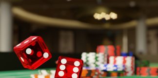 Close up shot of a pair of dice rolling down a craps table. Selective focus.Gambling concept. 3d illustration.