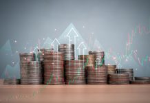 5 Simple Ways to Boost Your Earnings in 2024 Coins are lined up on a wooden floor along with index charts, arrows and candlesticks. Represents financial, economic, business growth concepts. Financial success concept.