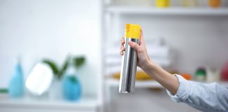 woman's hand a bottle of air freshener