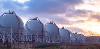 Gas storage tanks at sunset.