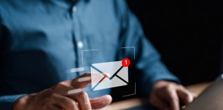 business man pointing at email icon