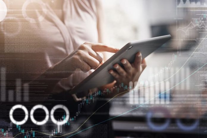 iStock-1765239638 (1) woman holding a tablet with graphs