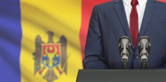 businessman making speech behind the flag of moldova