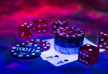 Casino abstract photo. Poker game on red background. Theme of gambling.