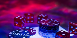 Casino abstract photo. Poker game on red background. Theme of gambling.