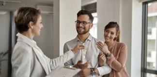 Residential manager turning over the key to the new owner