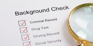 Background check with magnifying glass