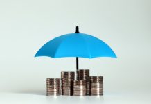 stack of coins with blue umbrella