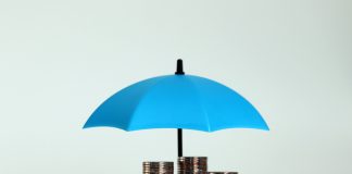 Securing Coverage: How an Insurance Litigation Attorney Can Help stack of coins with blue umbrella